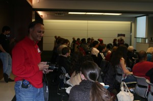 Swami Shashi B taking pictures and chatting at a packed house at Social Commerce Camp DC sponsored by KikScore and Network Solutions